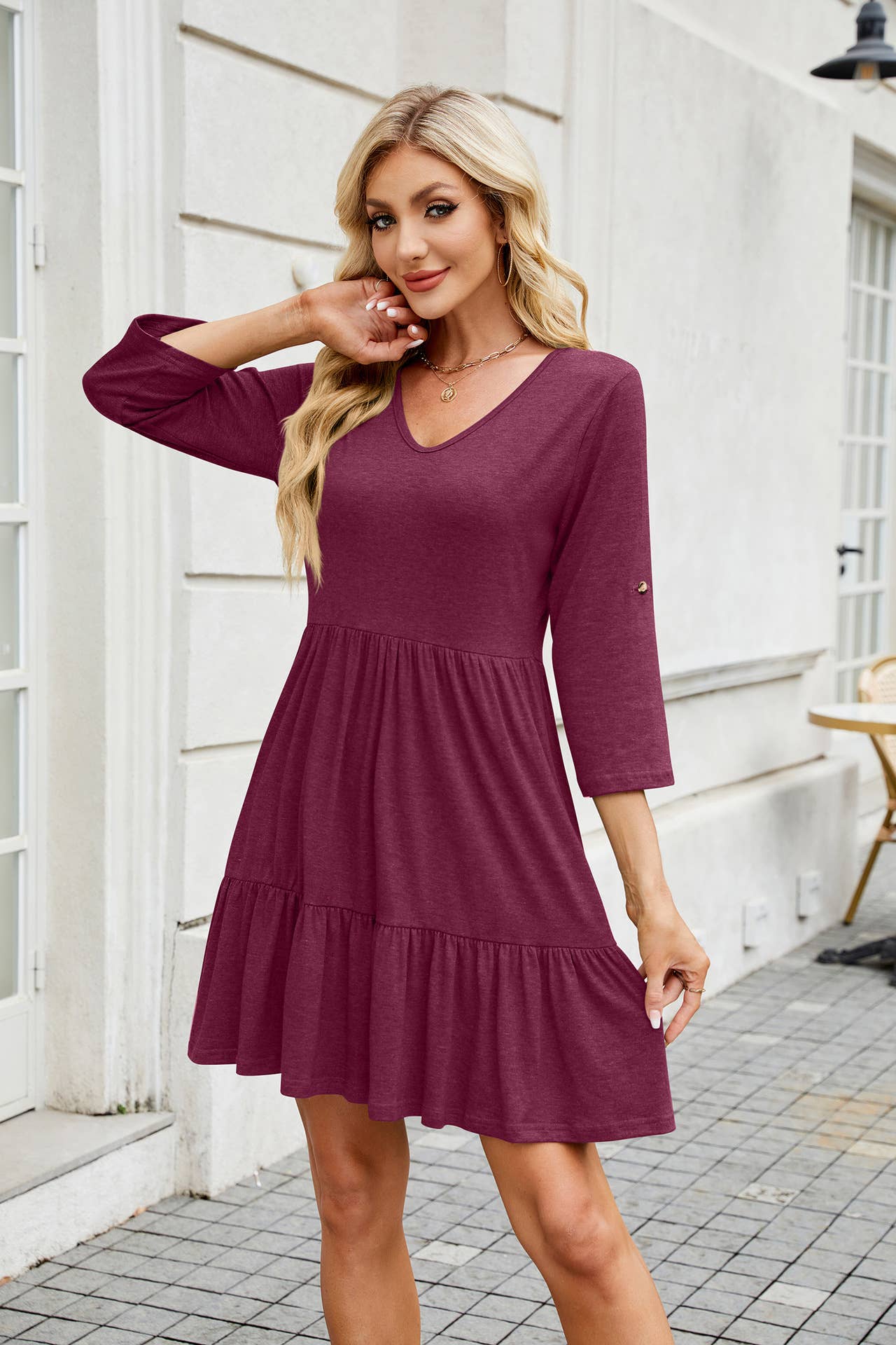 Solid color dress with V-neck pleats and ruffles