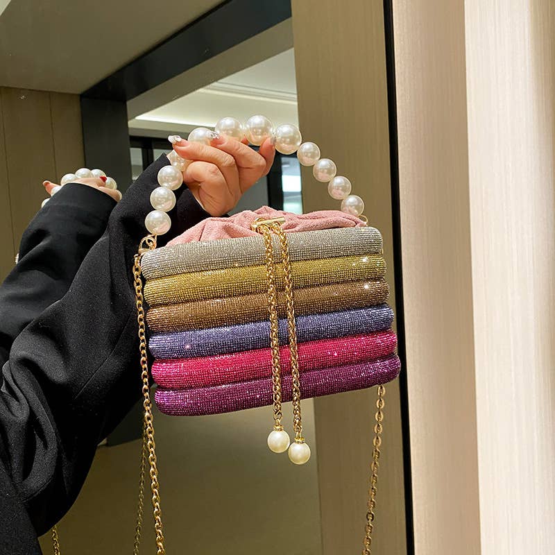 Slung over a pearl sparkling handbag