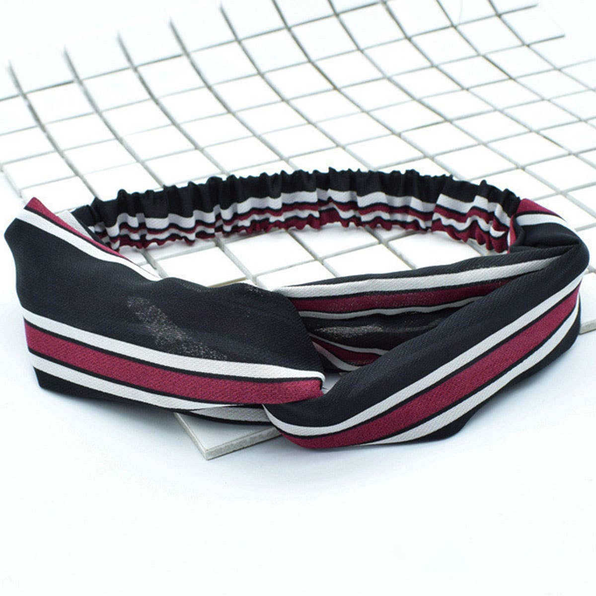 Silk hair band with interlaced patterns