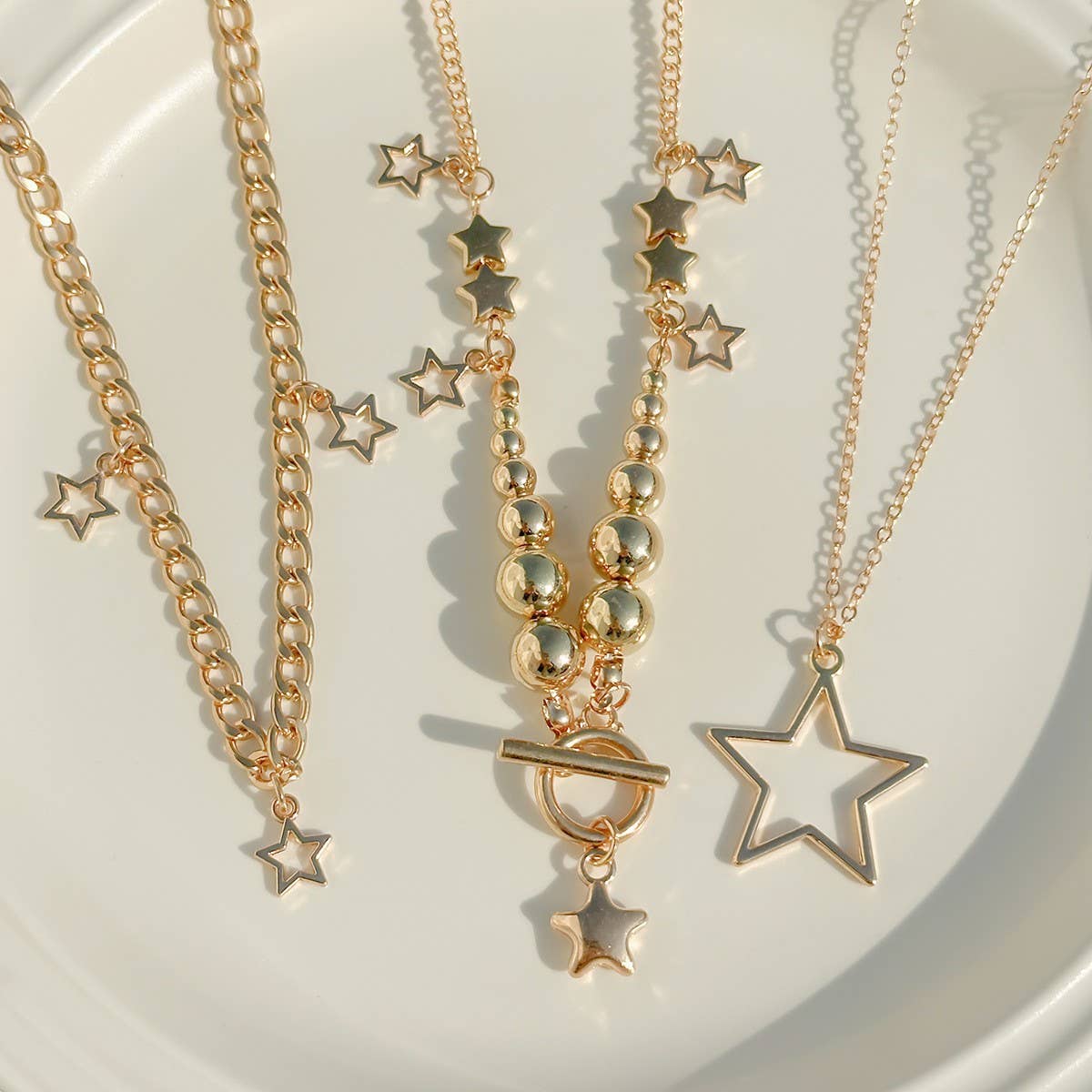 BEADED NECKLACE WITH STAR SHAPED PENDANT TASSELS_CWAJE1158