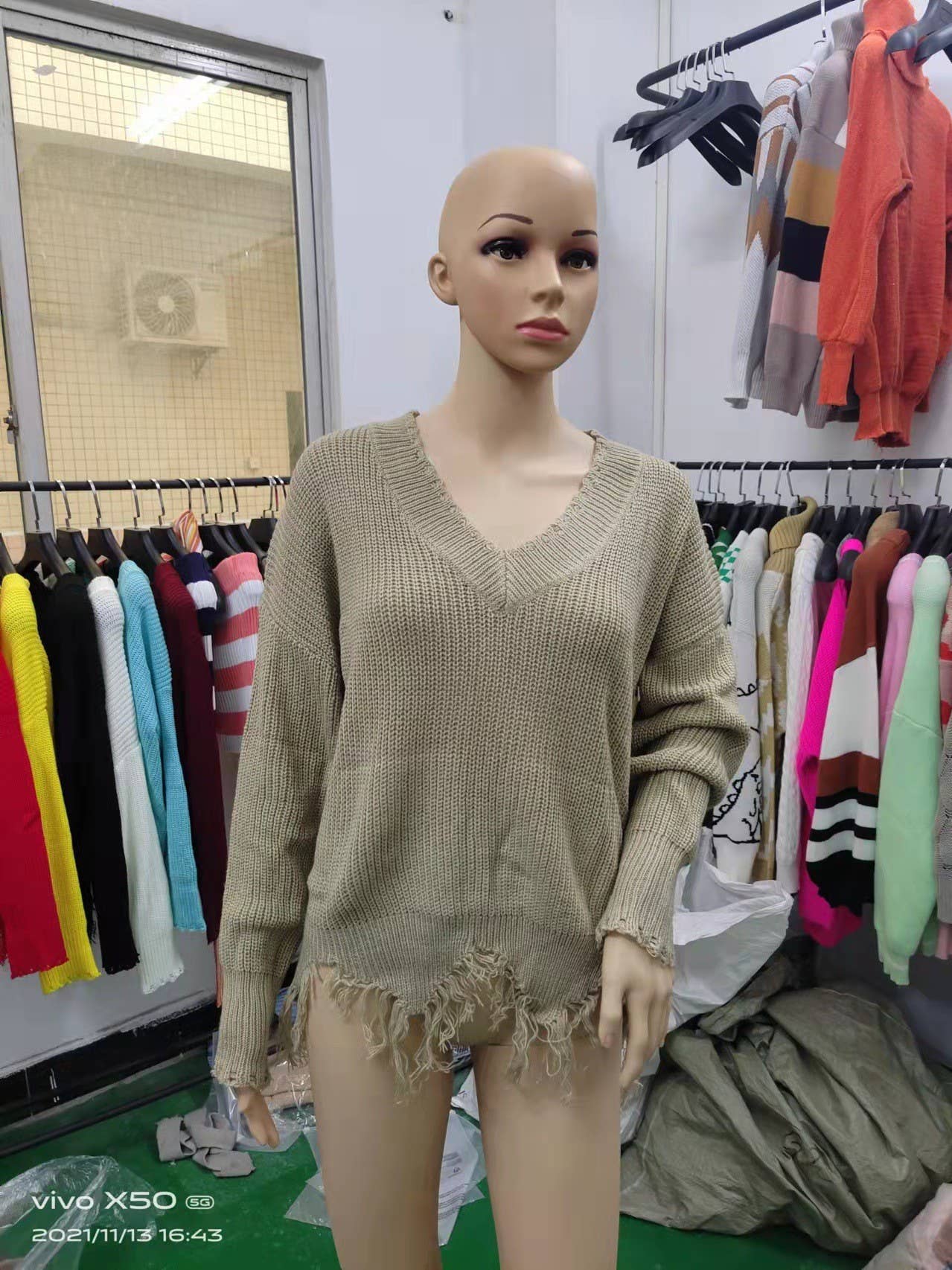 KNIT SWEATER WITH LARGE V-NECK FRINGE HEM