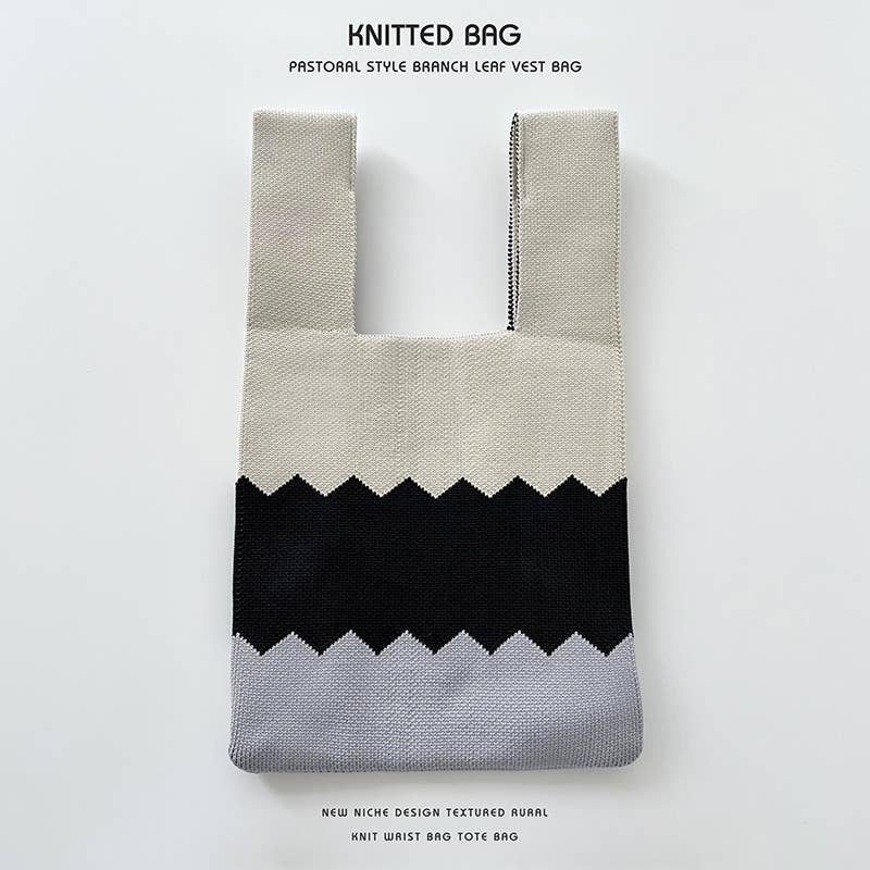 Heart-shaped color-blocked knitted handbag