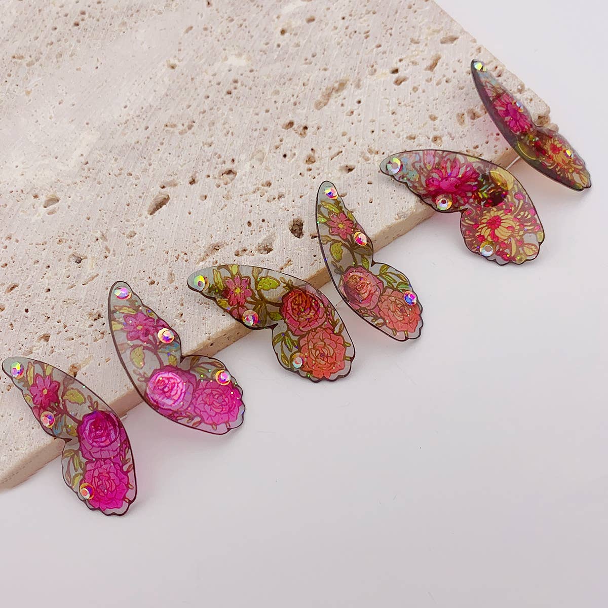 Painted ear studs with simulated butterfly wings