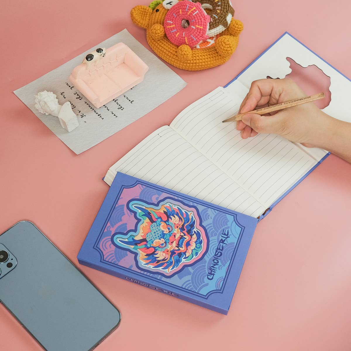 COLORFUL PORTABLE NOTEBOOK ON BLUE BACKGROUND