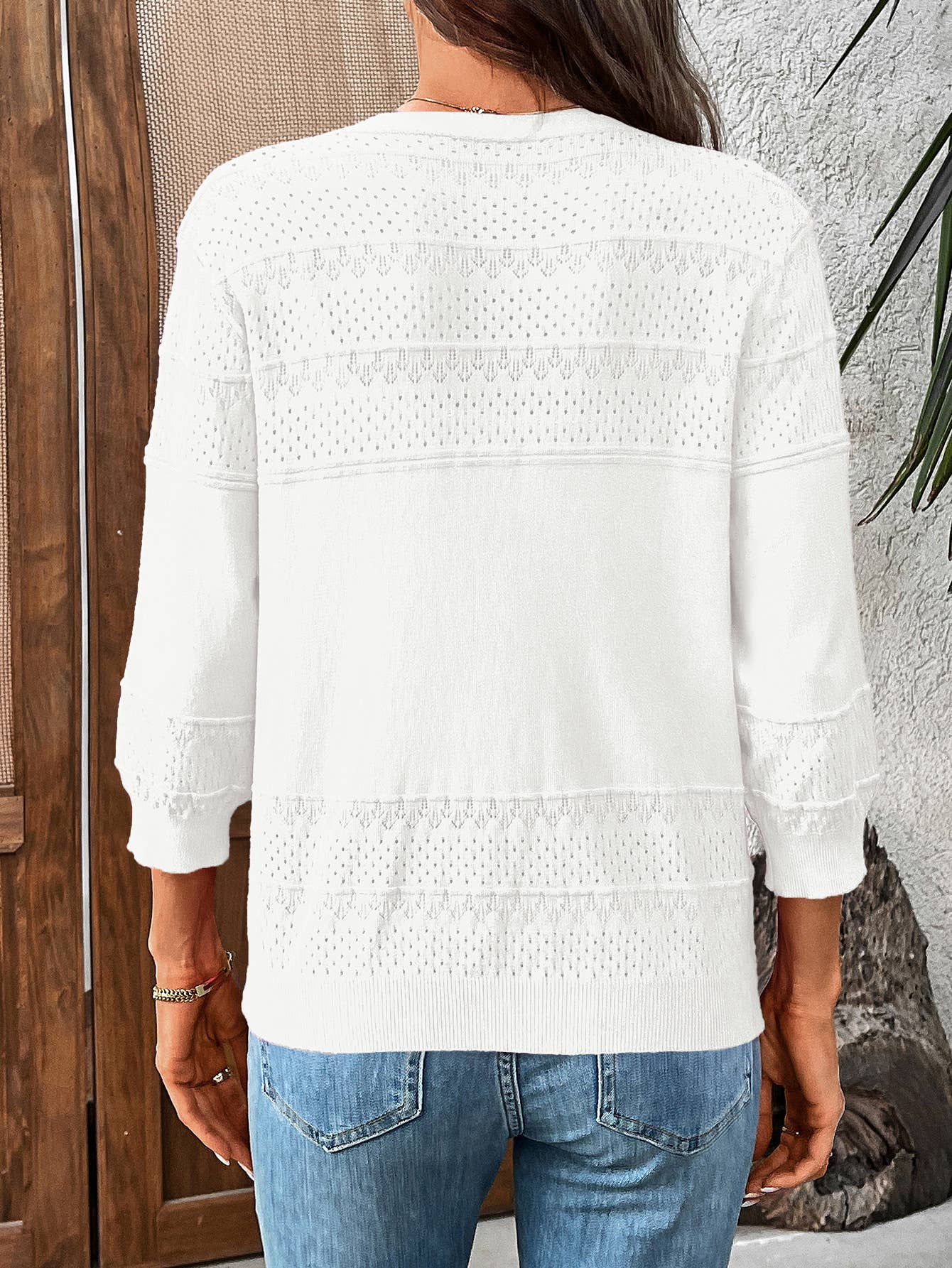 Three-quarter sleeve hollowed-out V-neck cardigan