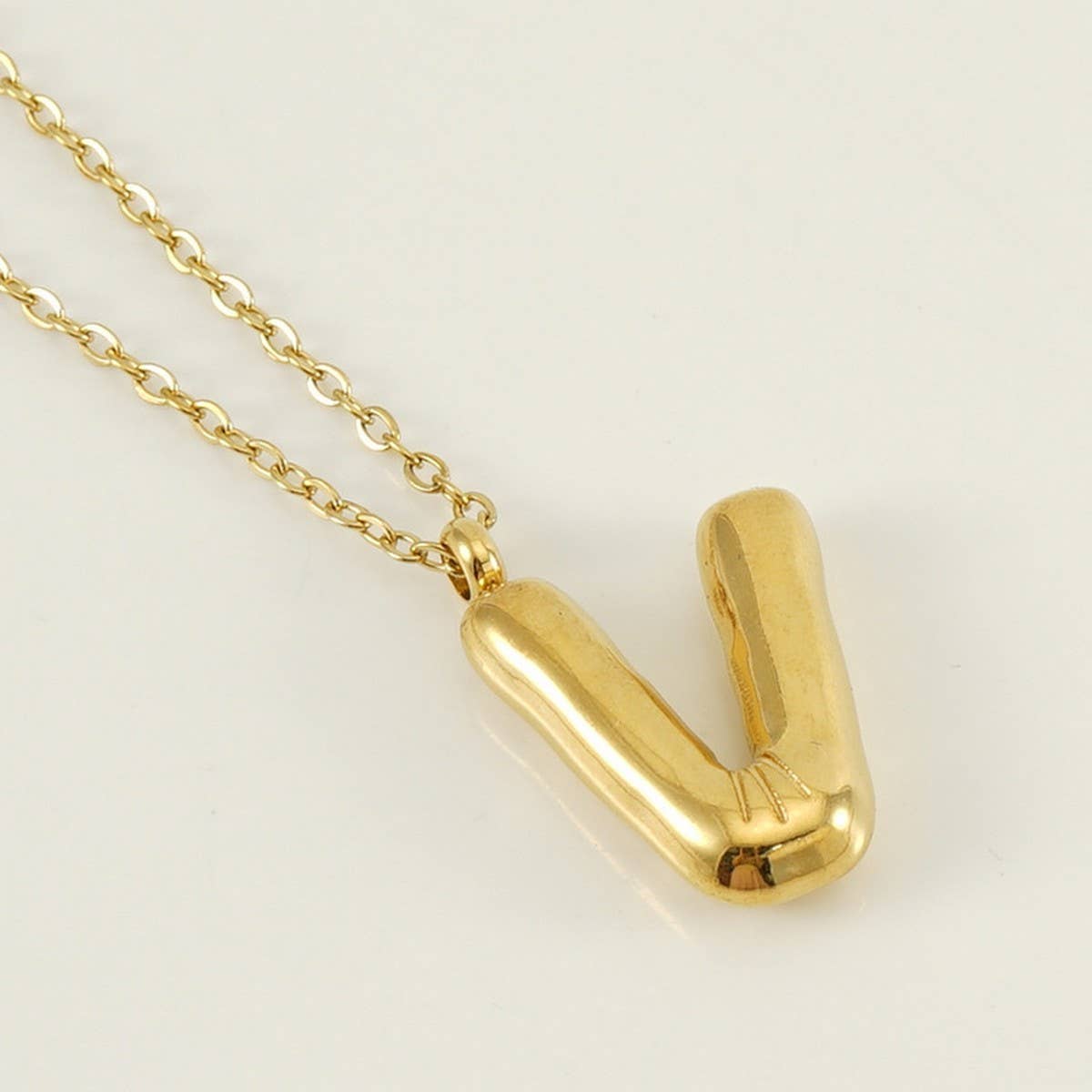 CWAJE1933_Stainless Steel Glossy Bubble Letter Necklace Gold