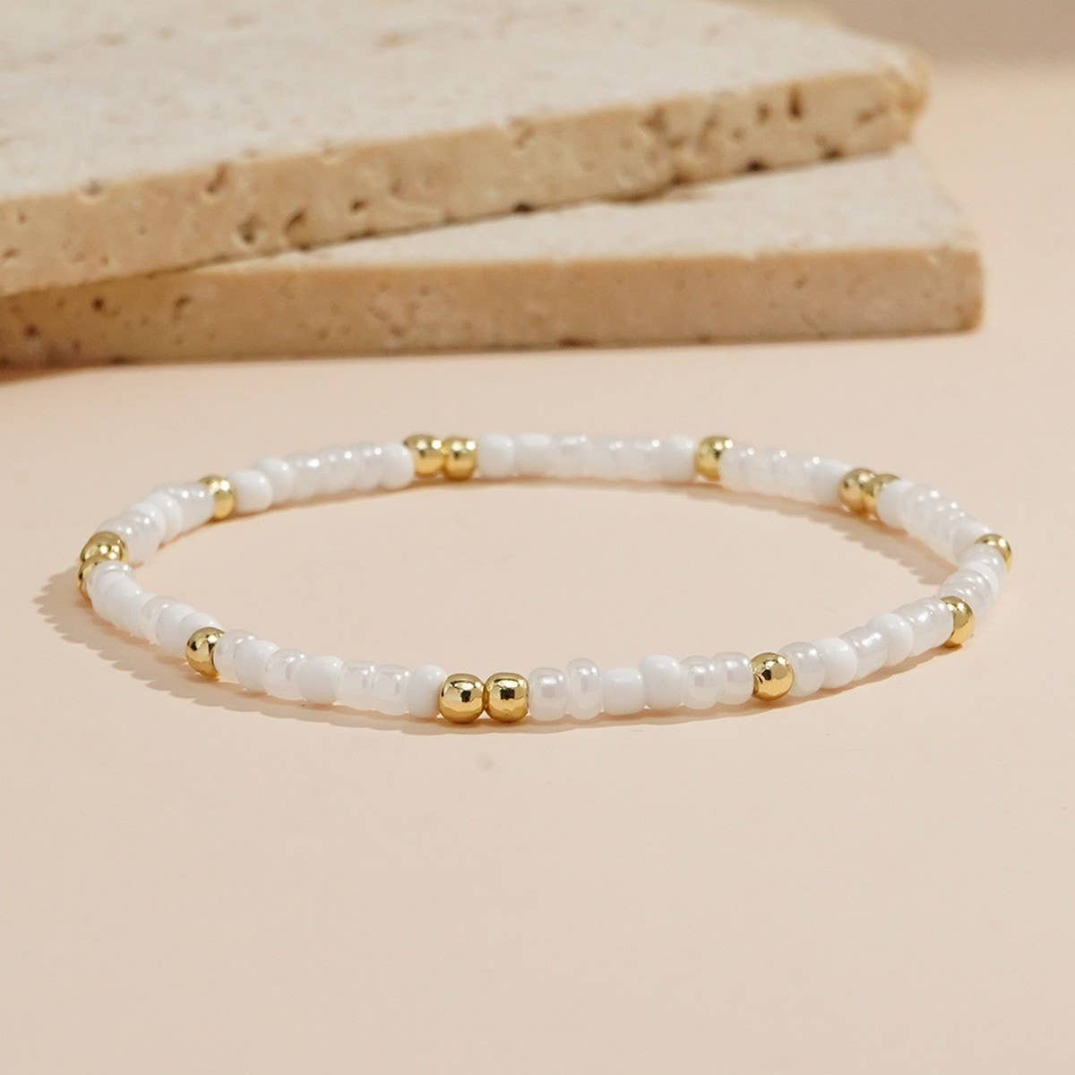 IMITATION PEARL CROSS RICE BEAD BRACELET