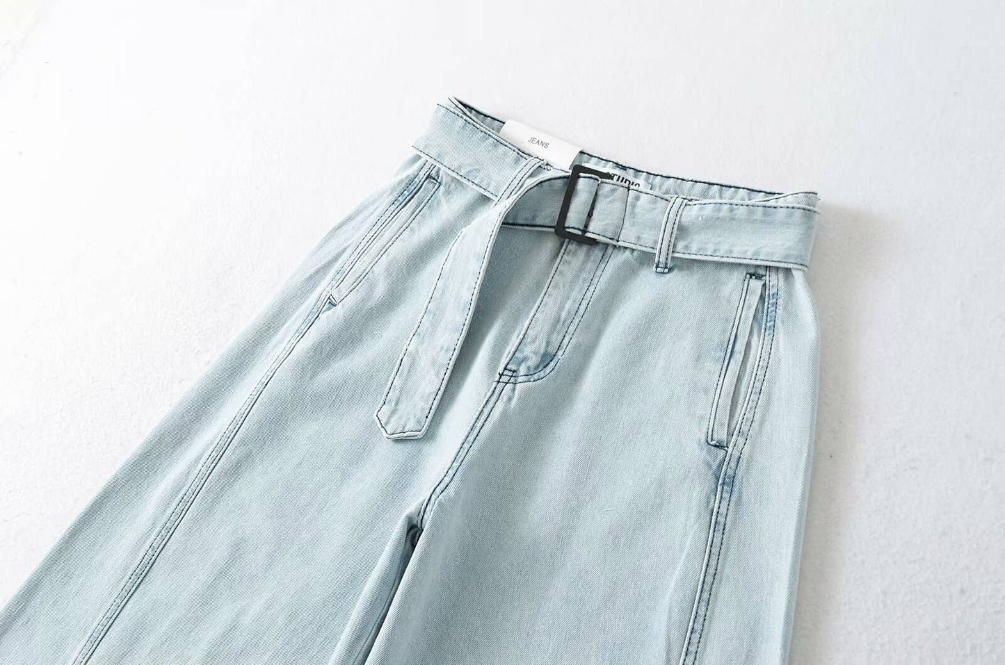 High street girls pair wide-leg jeans with belts