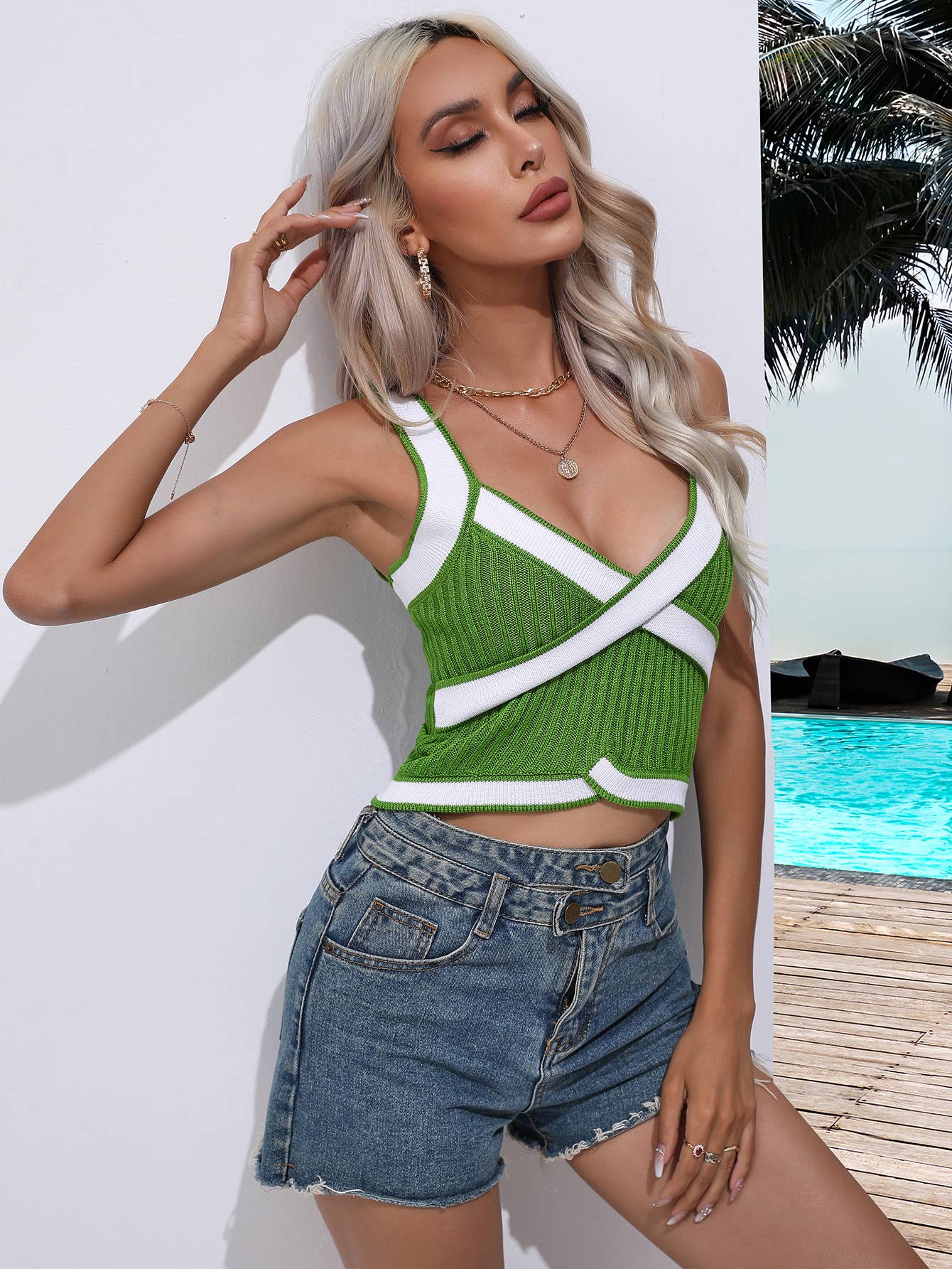 SLEEVELESS V-NECK SWEATER WITH CROSS HALTER