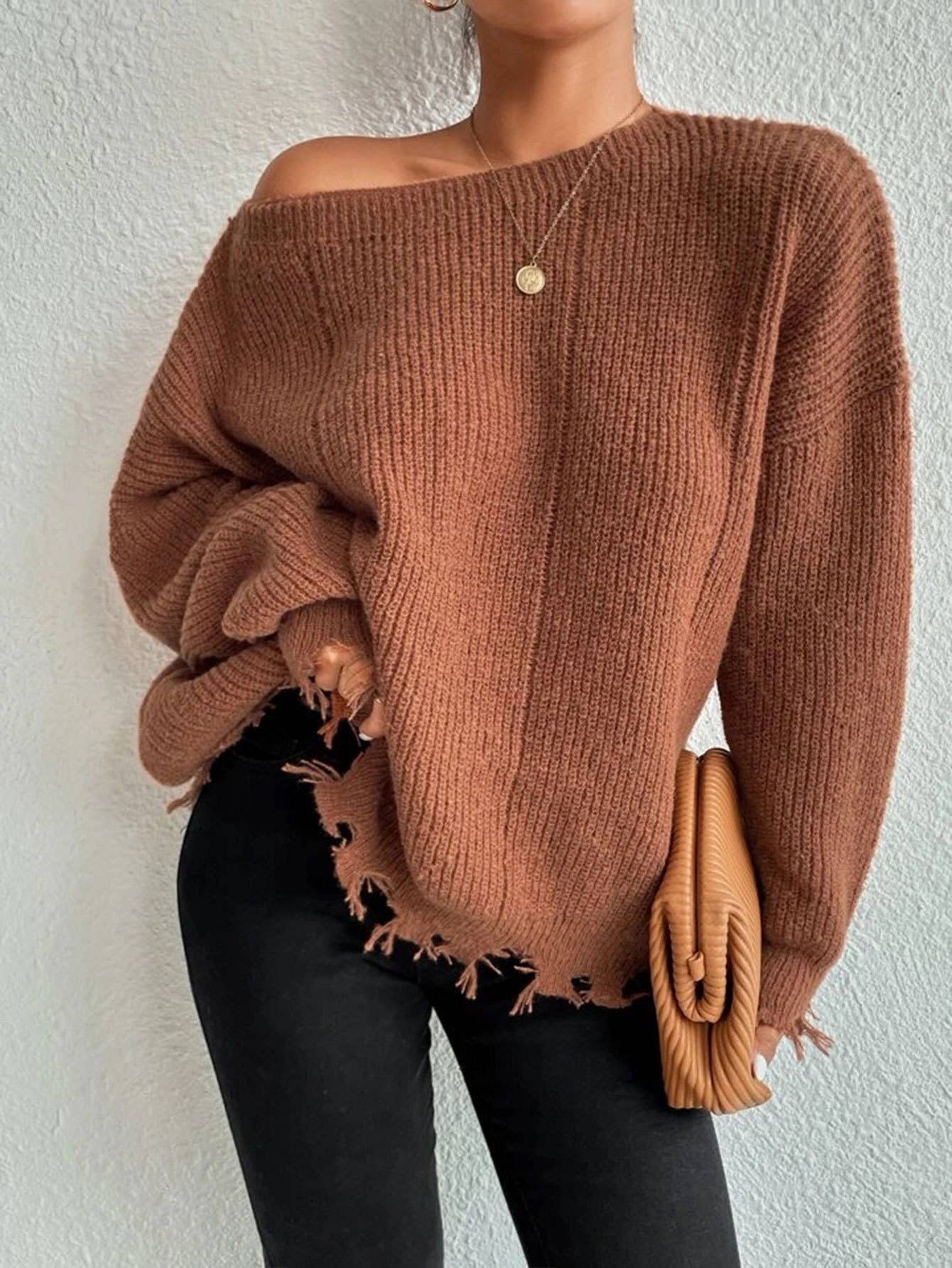 Laid-back style distressed frayed sweater