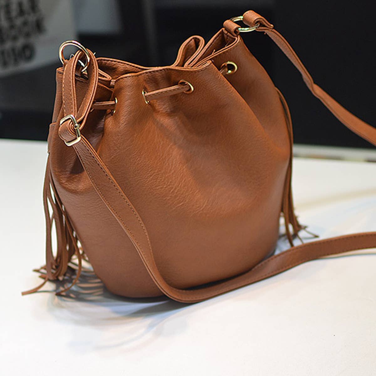 WOMEN LEATHER TASSEL BUCKET BAG_CWAB0791