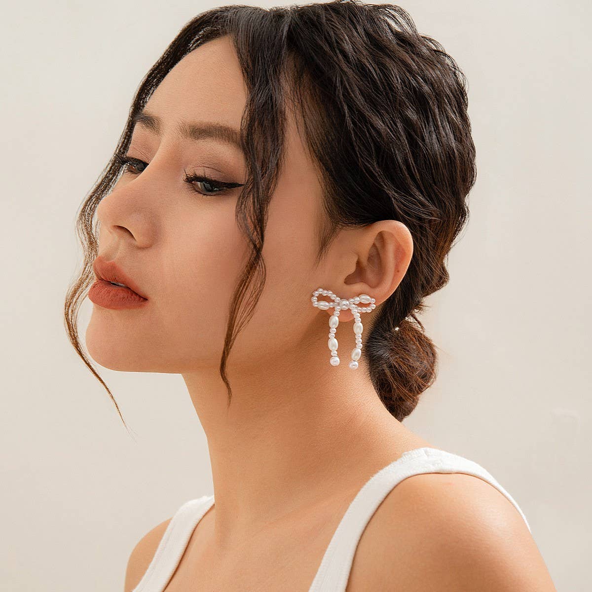 BOW FRENCH TASSEL PEARL EARRINGS_CWAJE1156