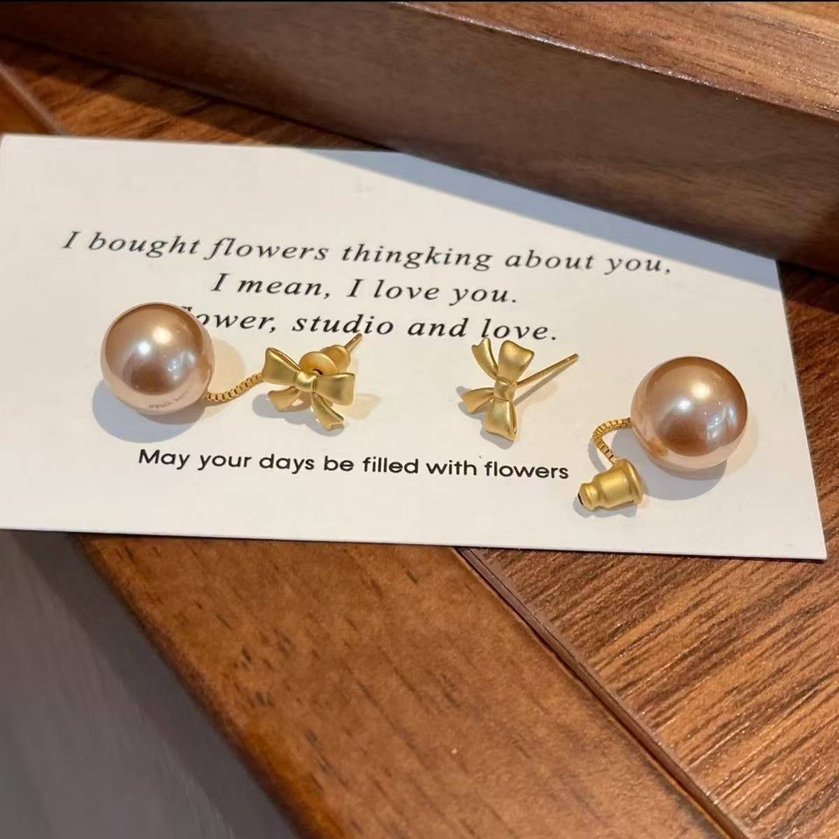 LIGHT LUXURY CHAMPAGNE COLOR PENDANT BOW EARRINGS