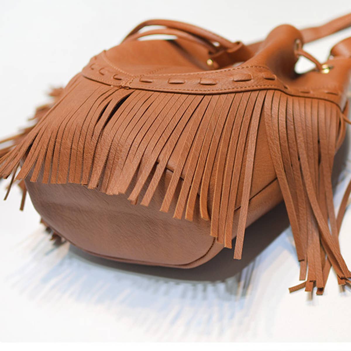 WOMEN LEATHER TASSEL BUCKET BAG_CWAB0791