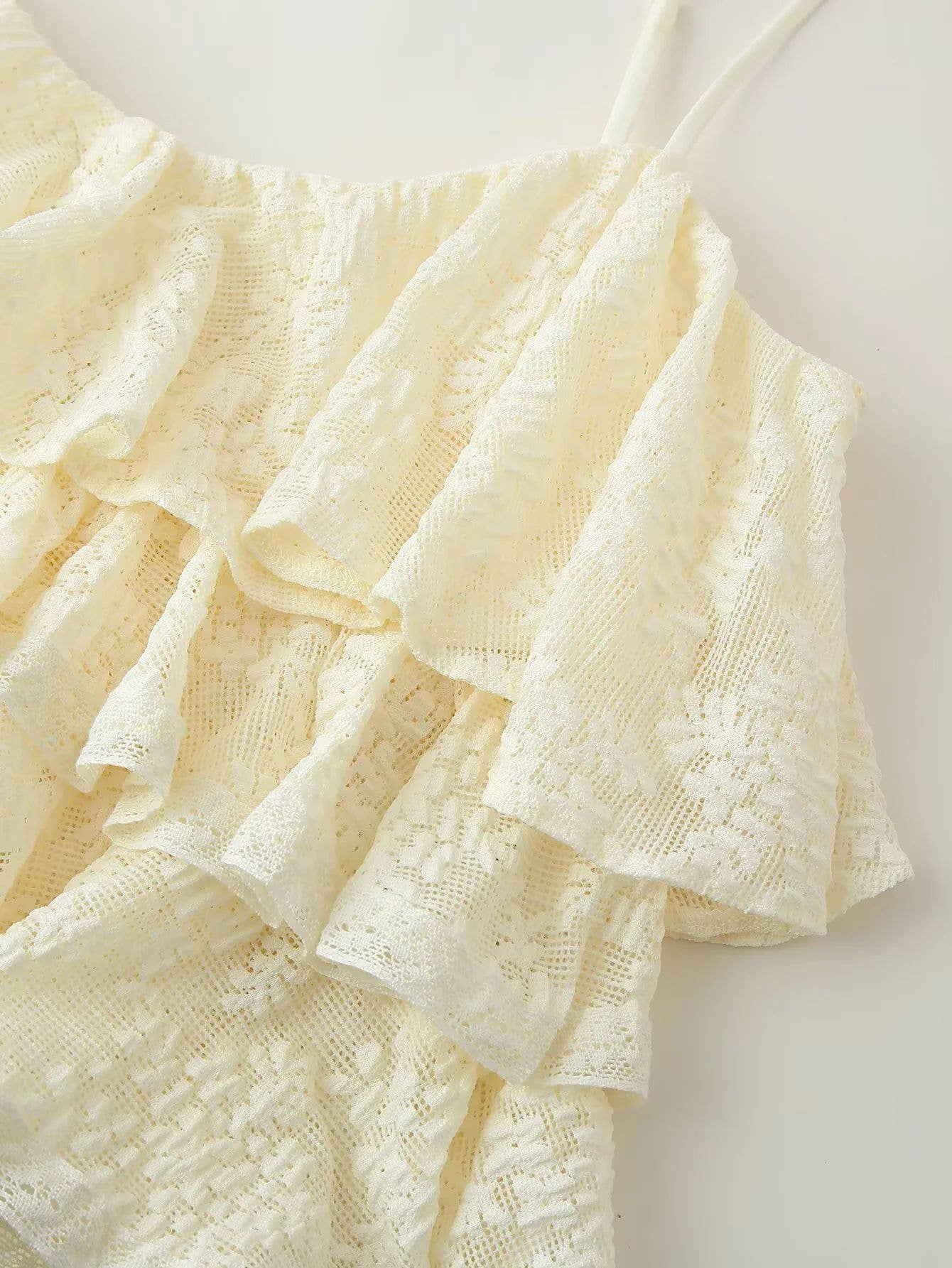 A pure color ruffled design halter top