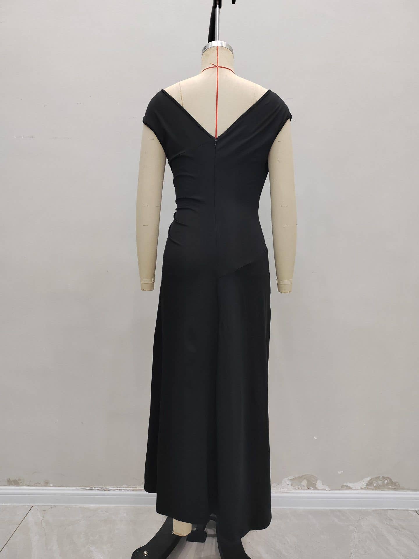 Simple pleated buttons adorn the dress
