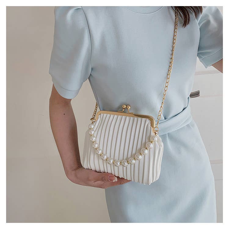 Pearl shell bag diagonally across the body