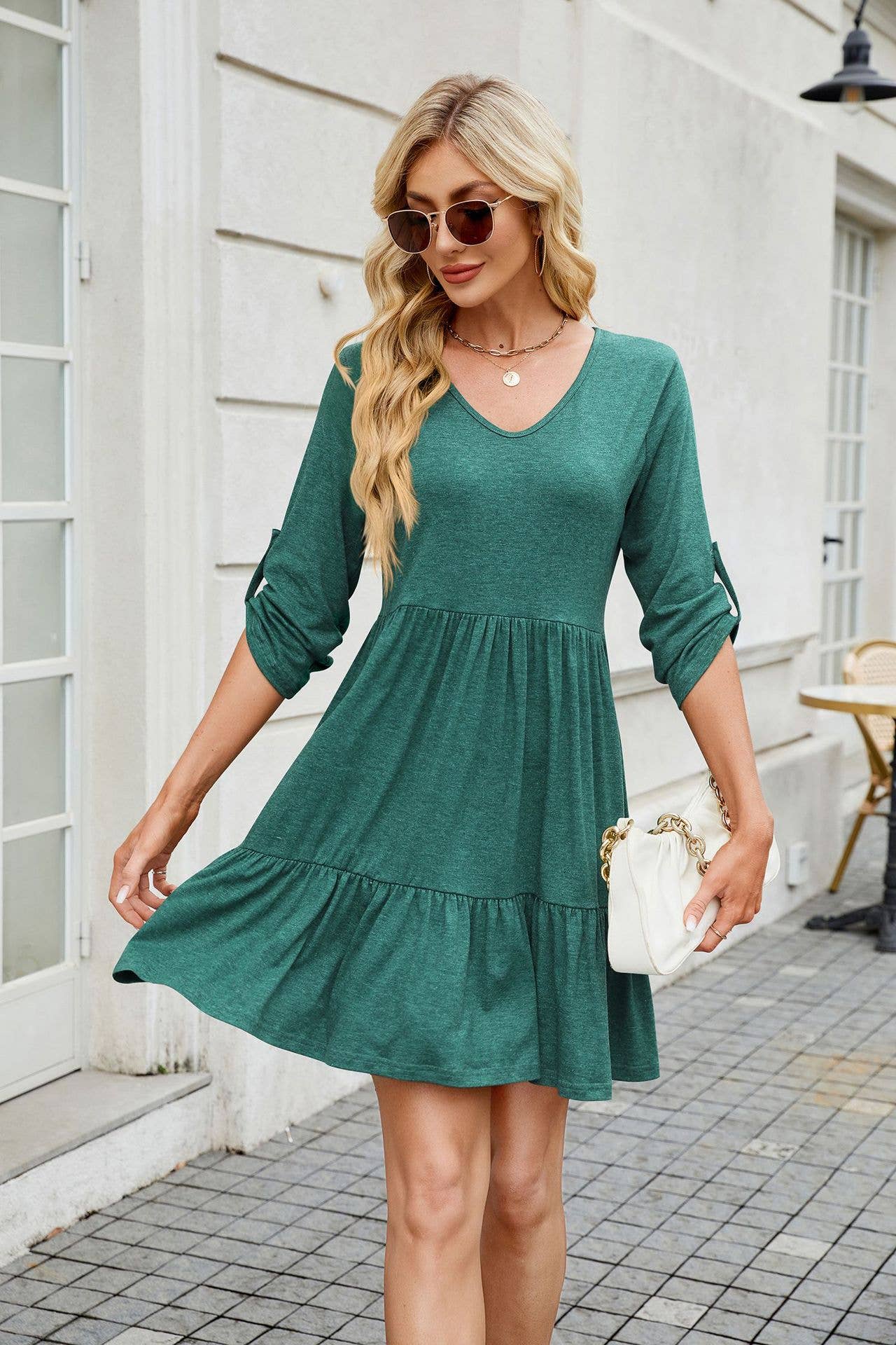 Solid color dress with V-neck pleats and ruffles