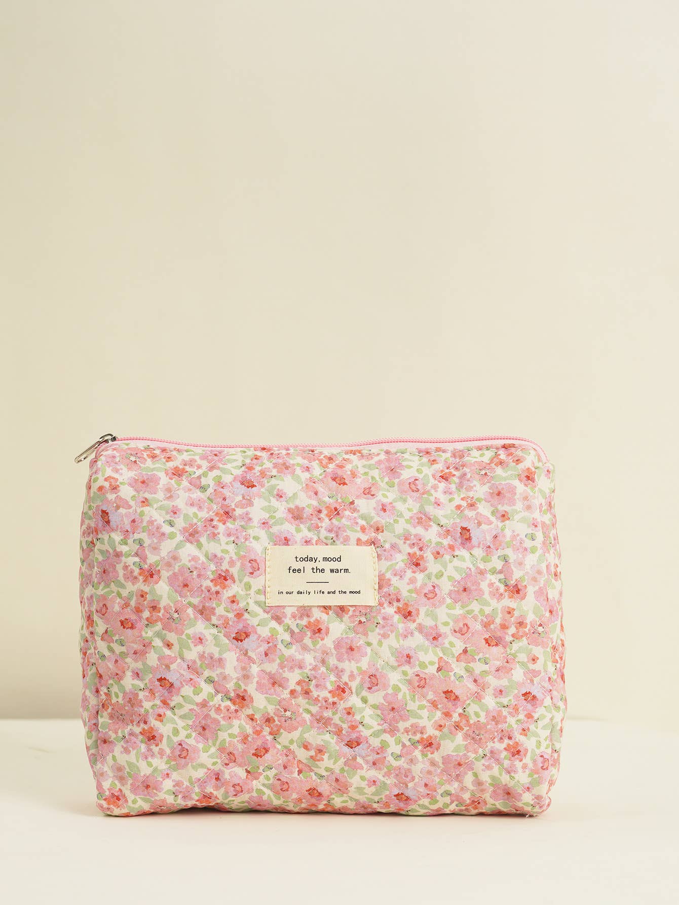 Four-piece set of quilted floral makeup bags
