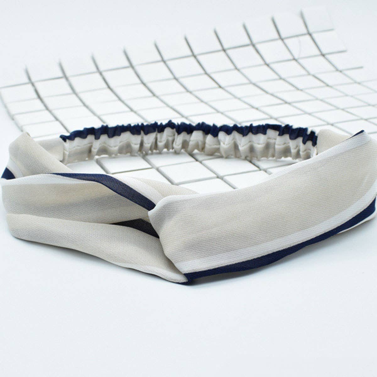 Silk hair band with interlaced patterns