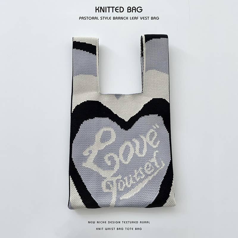 Heart-shaped color-blocked knitted handbag