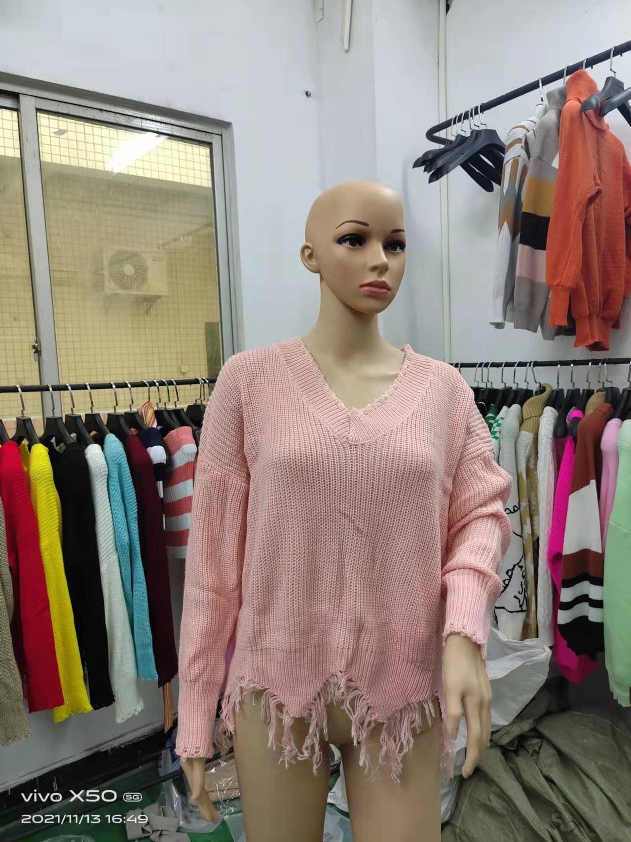 KNIT SWEATER WITH LARGE V-NECK FRINGE HEM