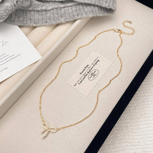 MICRO-PAVED ZIRCONIA PEARL BOW PENDANT NECKLACE