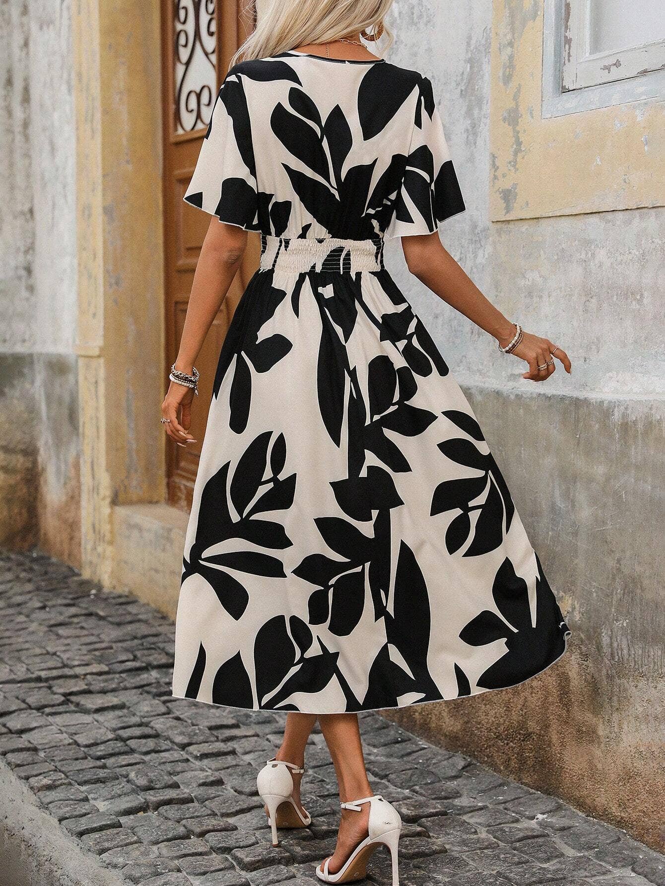 A cross-neck belt floral printed slit dress