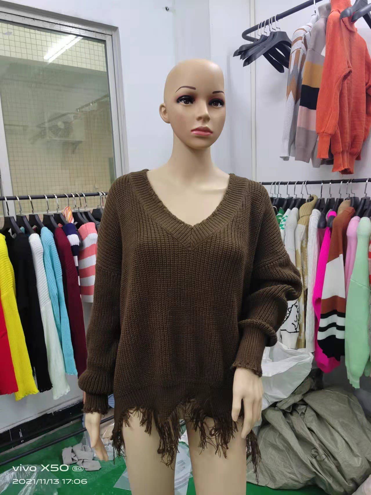 KNIT SWEATER WITH LARGE V-NECK FRINGE HEM