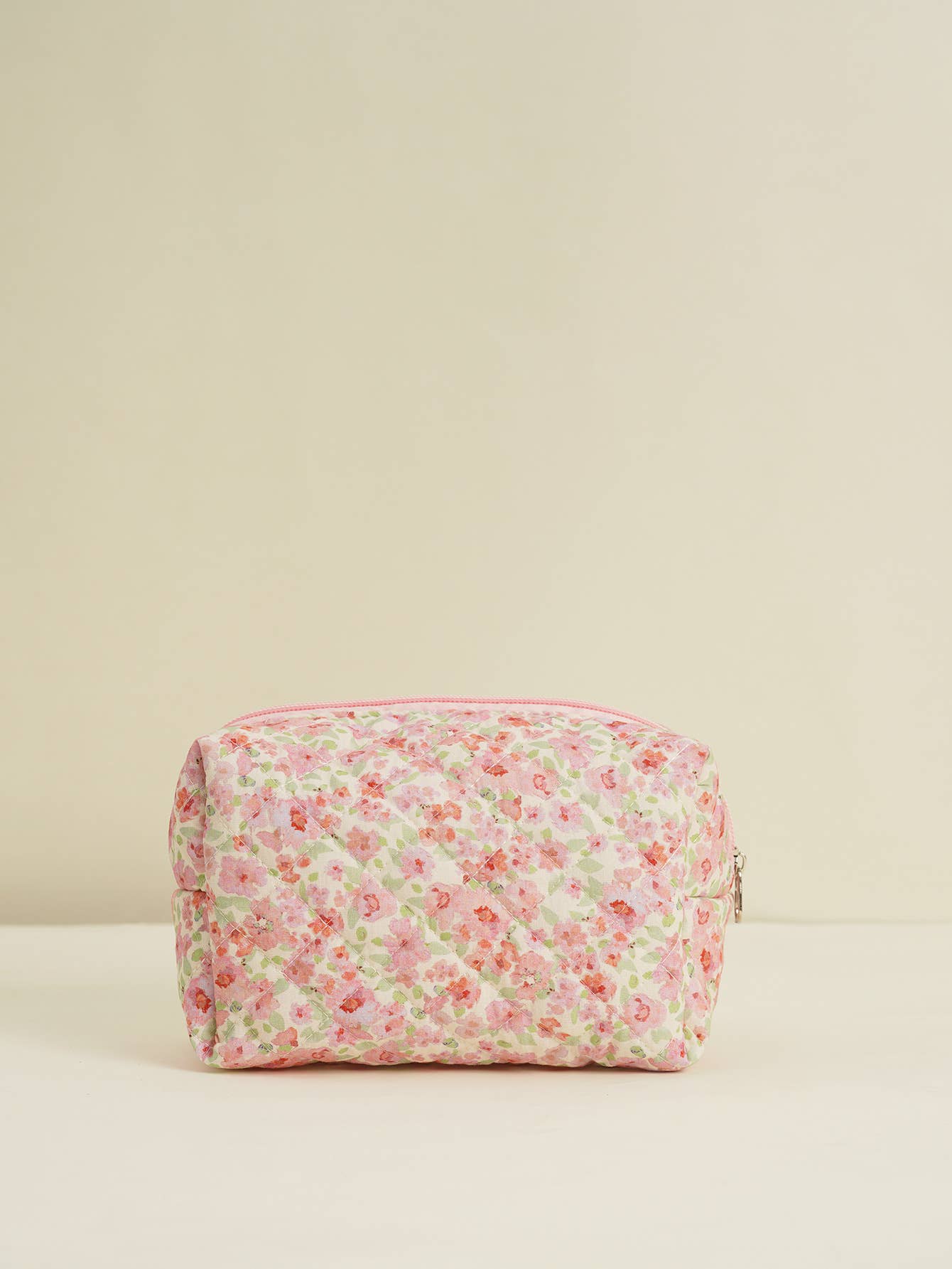 Four-piece set of quilted floral makeup bags