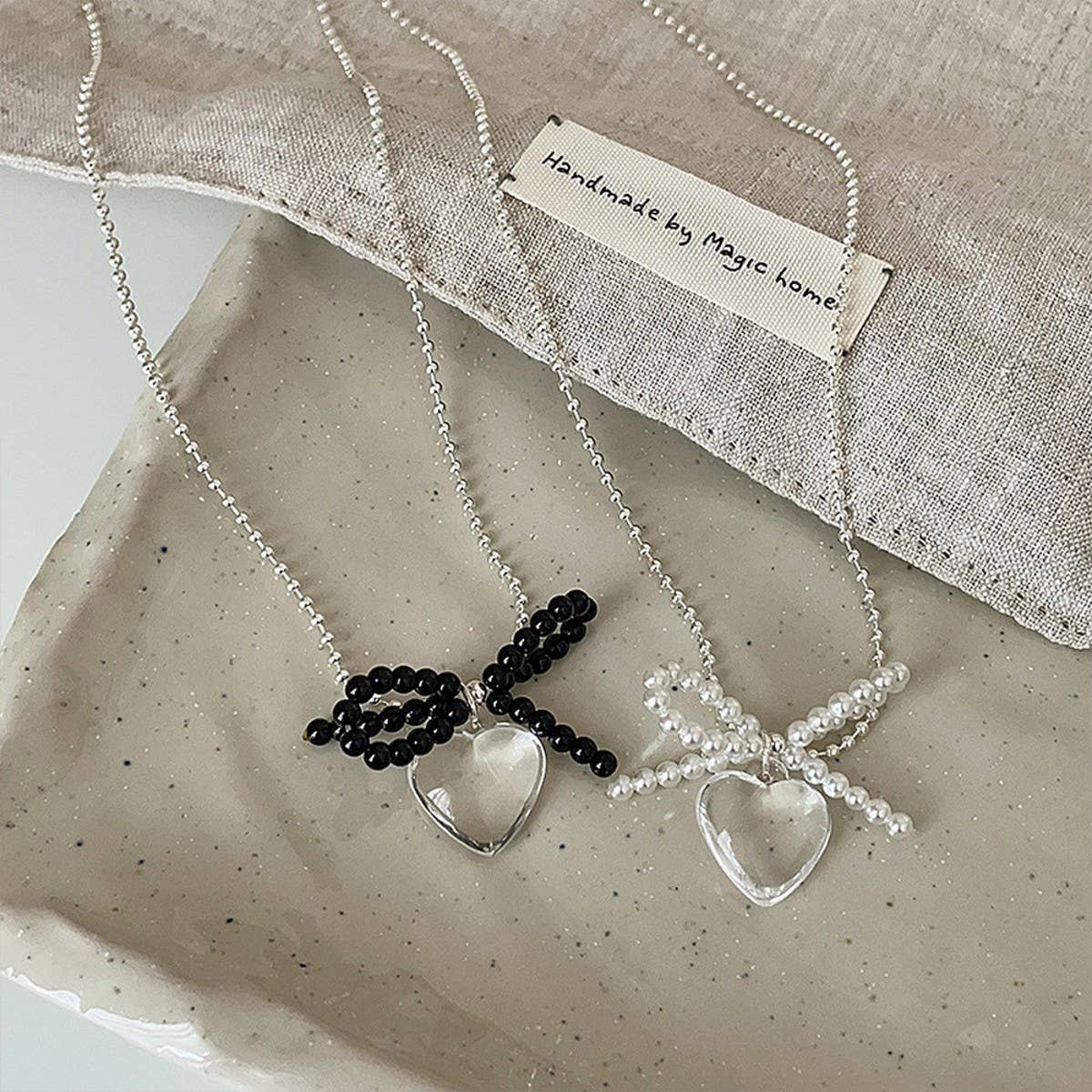 FASHION TRANSPARENT HEART PENDANT BOW NECKLACE_CWAJE3073