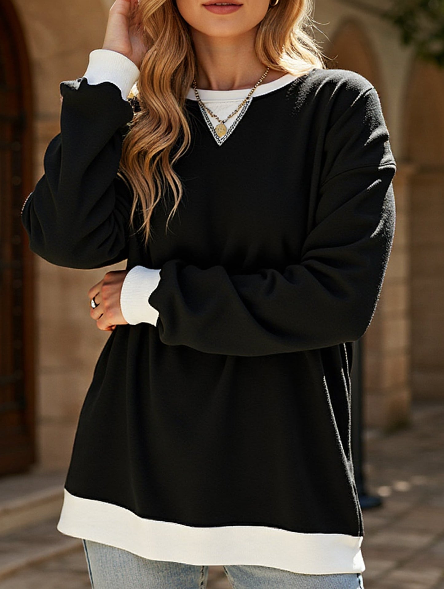 Contrast color splicing round neck sweater