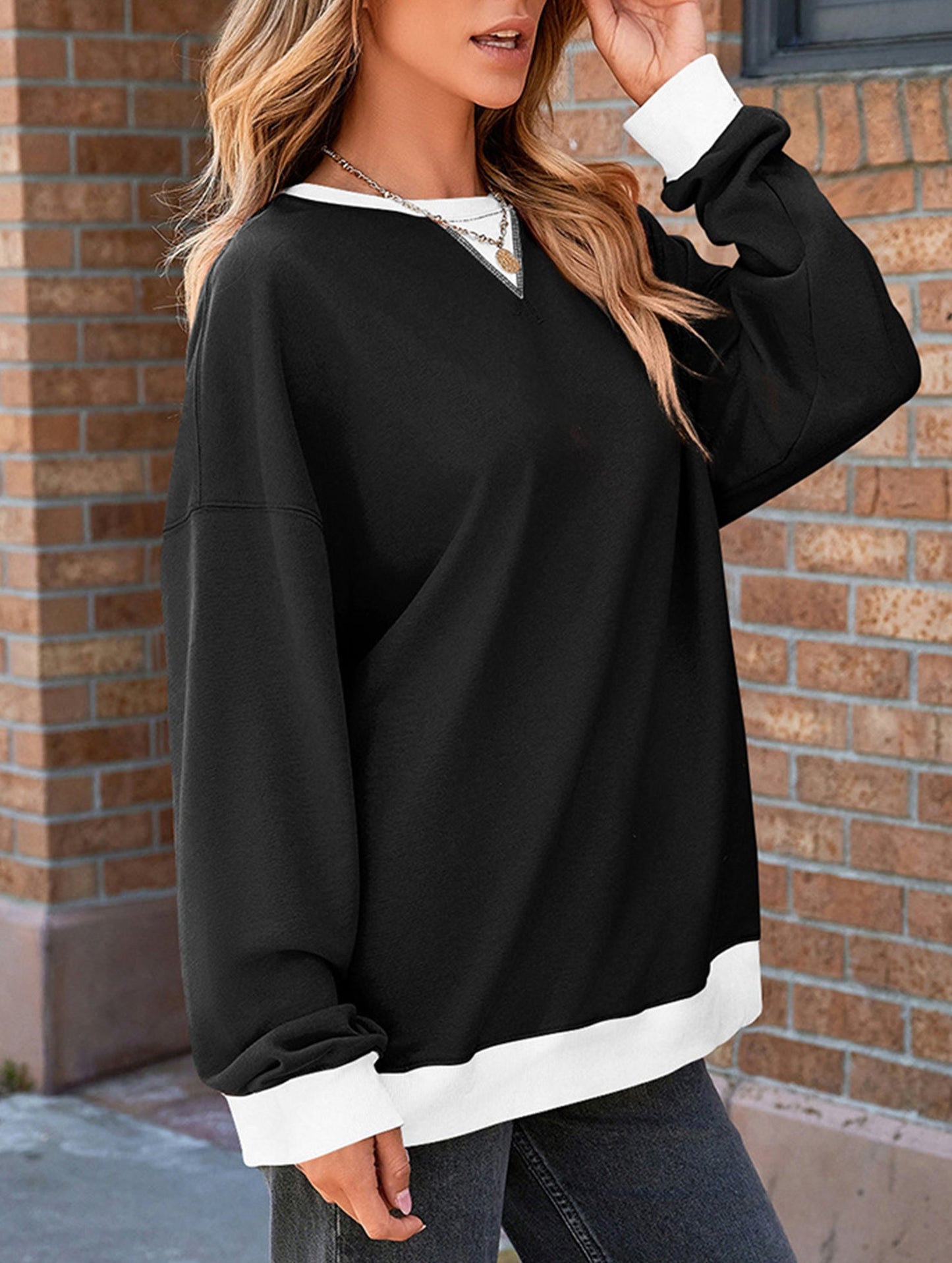 Contrast color splicing round neck sweater