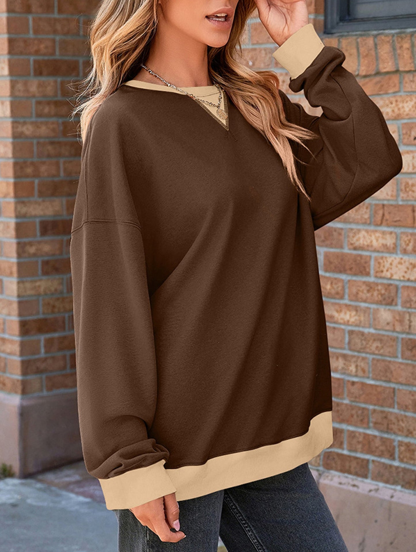 Contrast color splicing round neck sweater