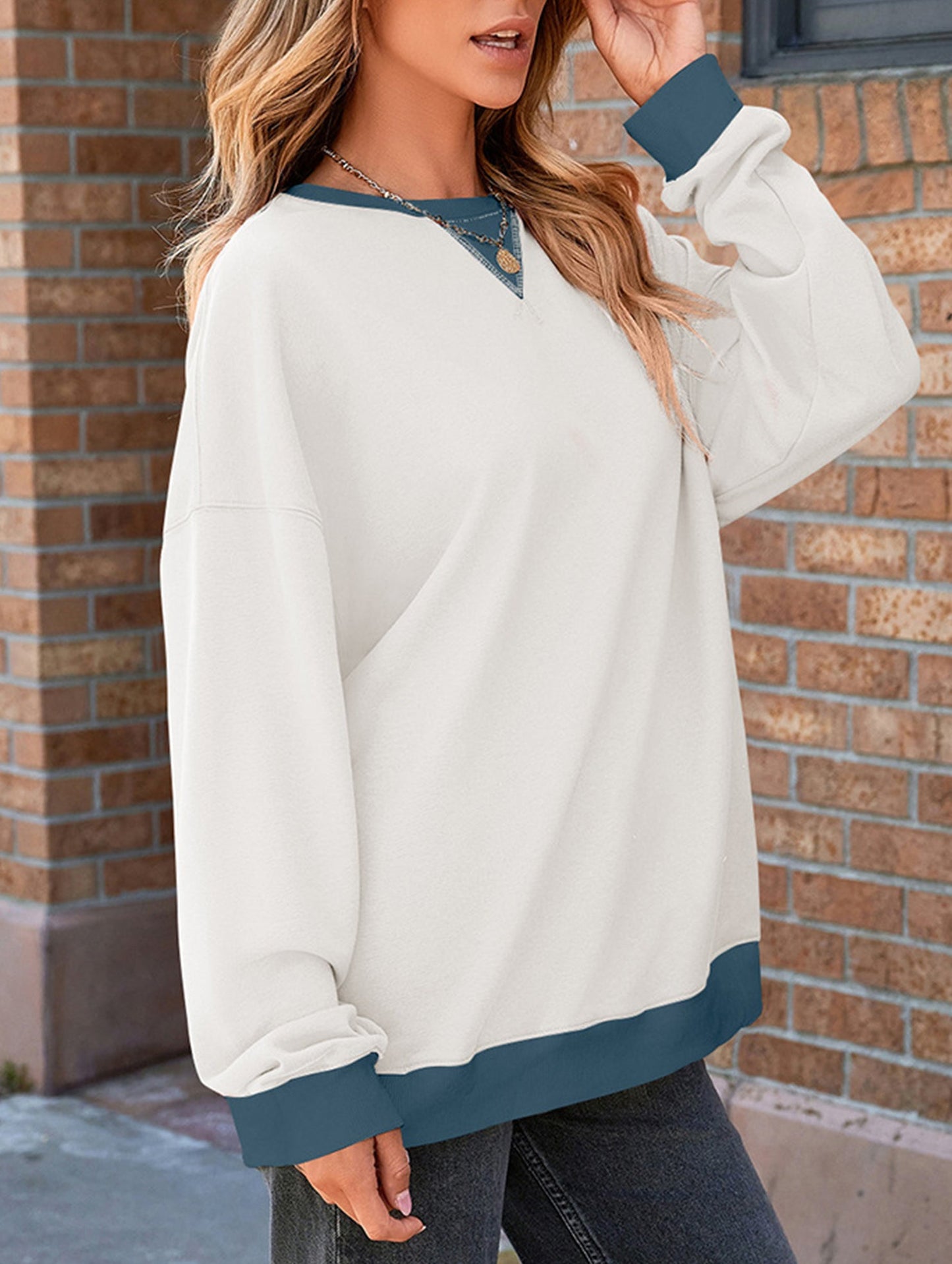 Contrast color splicing round neck sweater