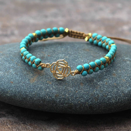 GOLD TONE REIKI SYMBOL YOGA BRAIDED BRACELET