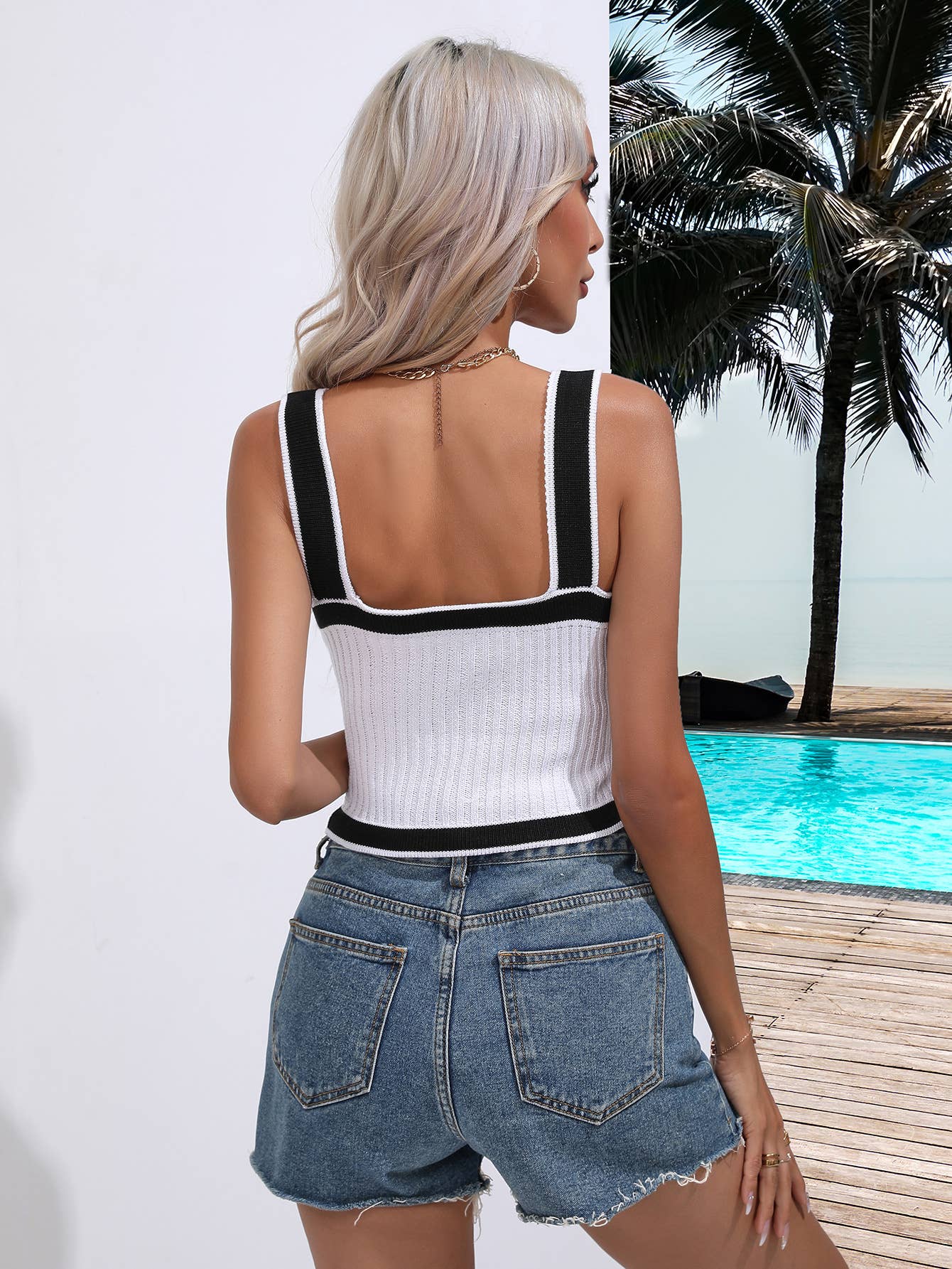 SLEEVELESS V-NECK SWEATER WITH CROSS HALTER