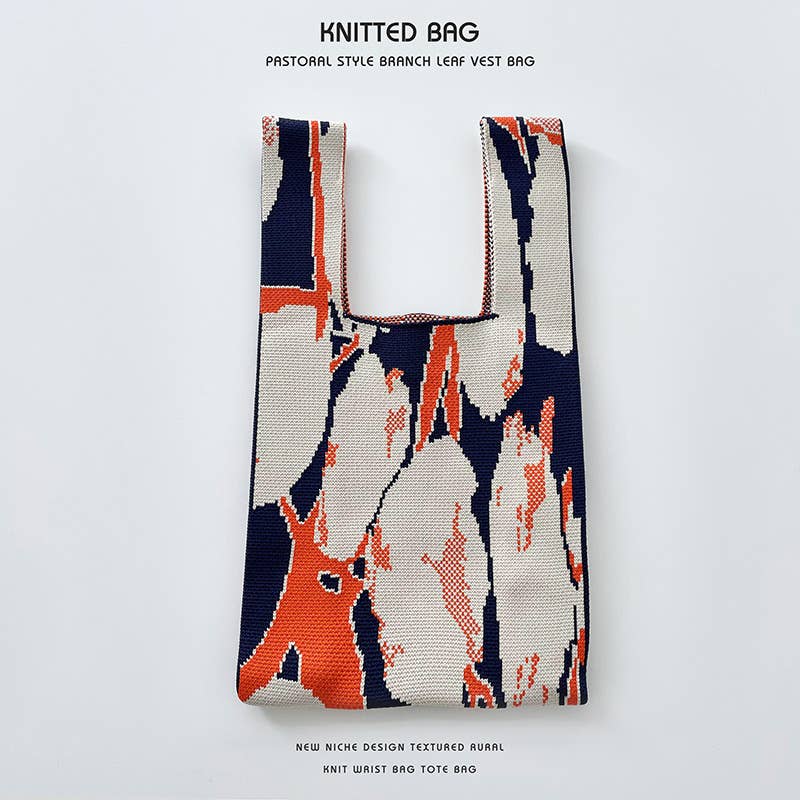 Heart-shaped color-blocked knitted handbag