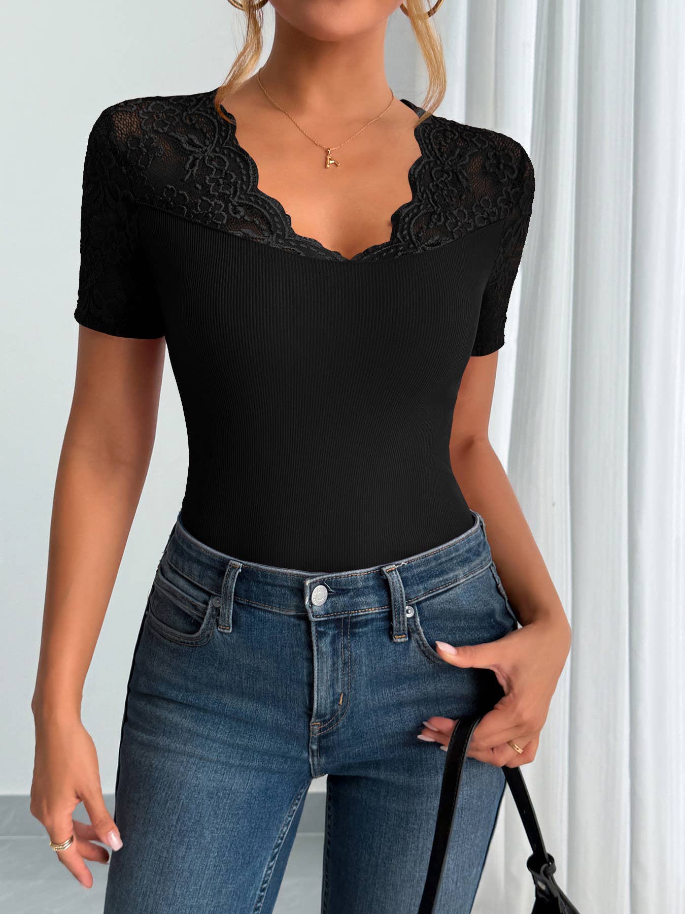 A lace-trimmed top with collared and cuffs