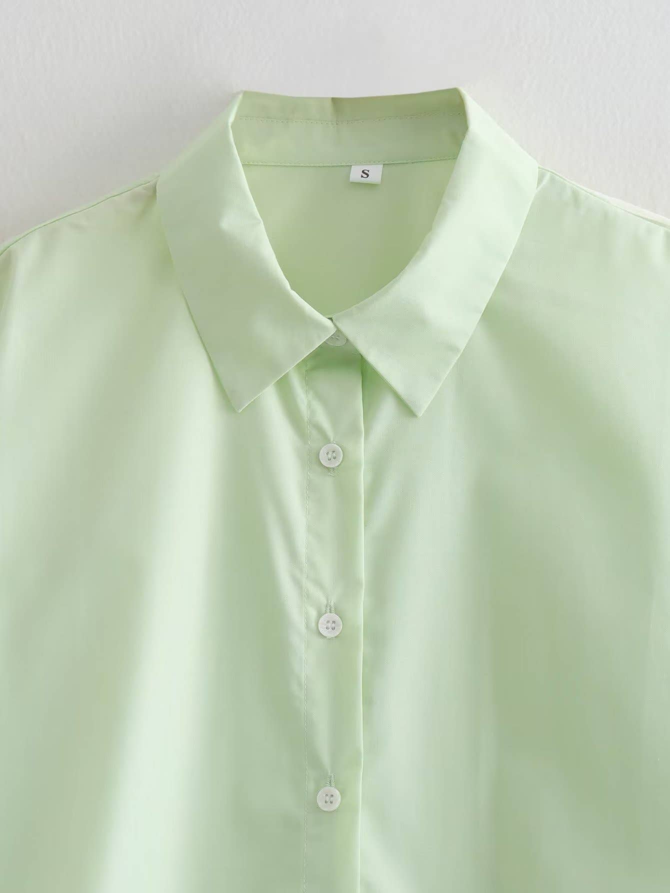 Side-drawstring long-sleeved solid-color shirt