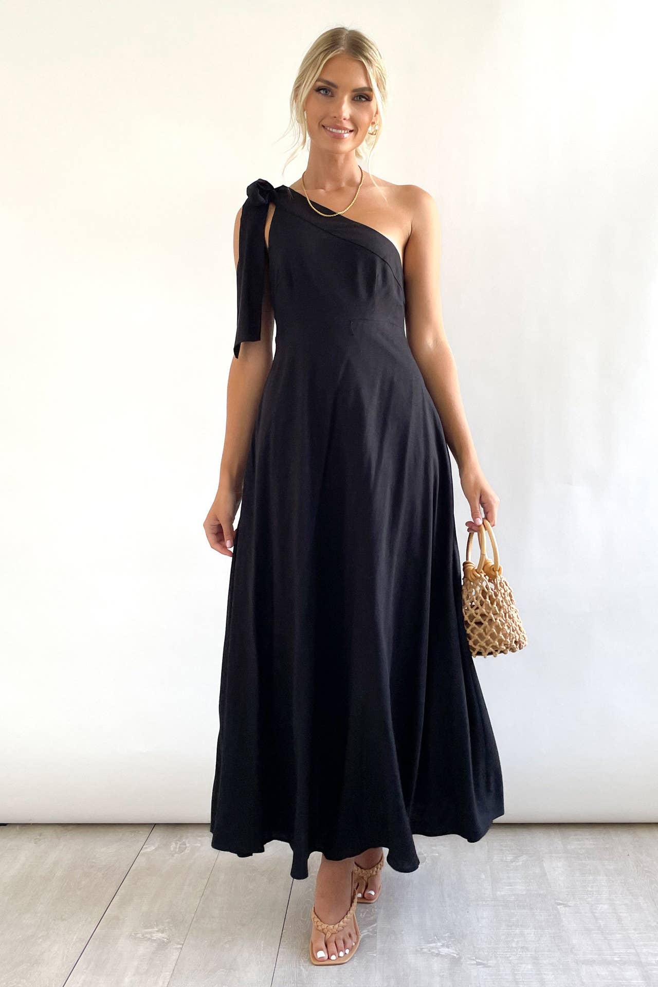 One-shoulder dress with sloping neck