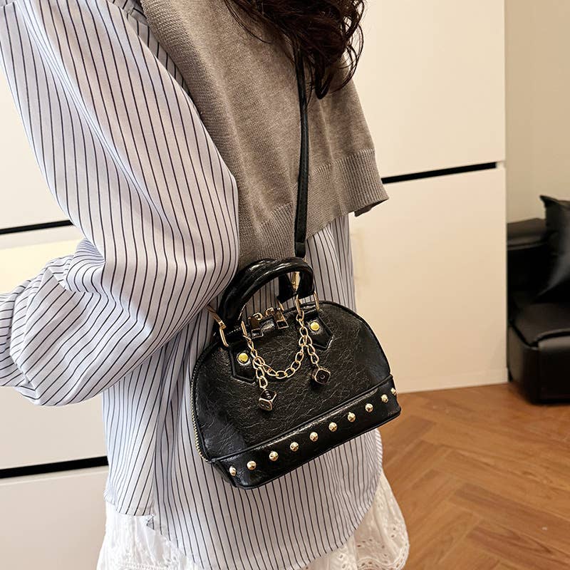 Fashionable riveted single-shoulder bag