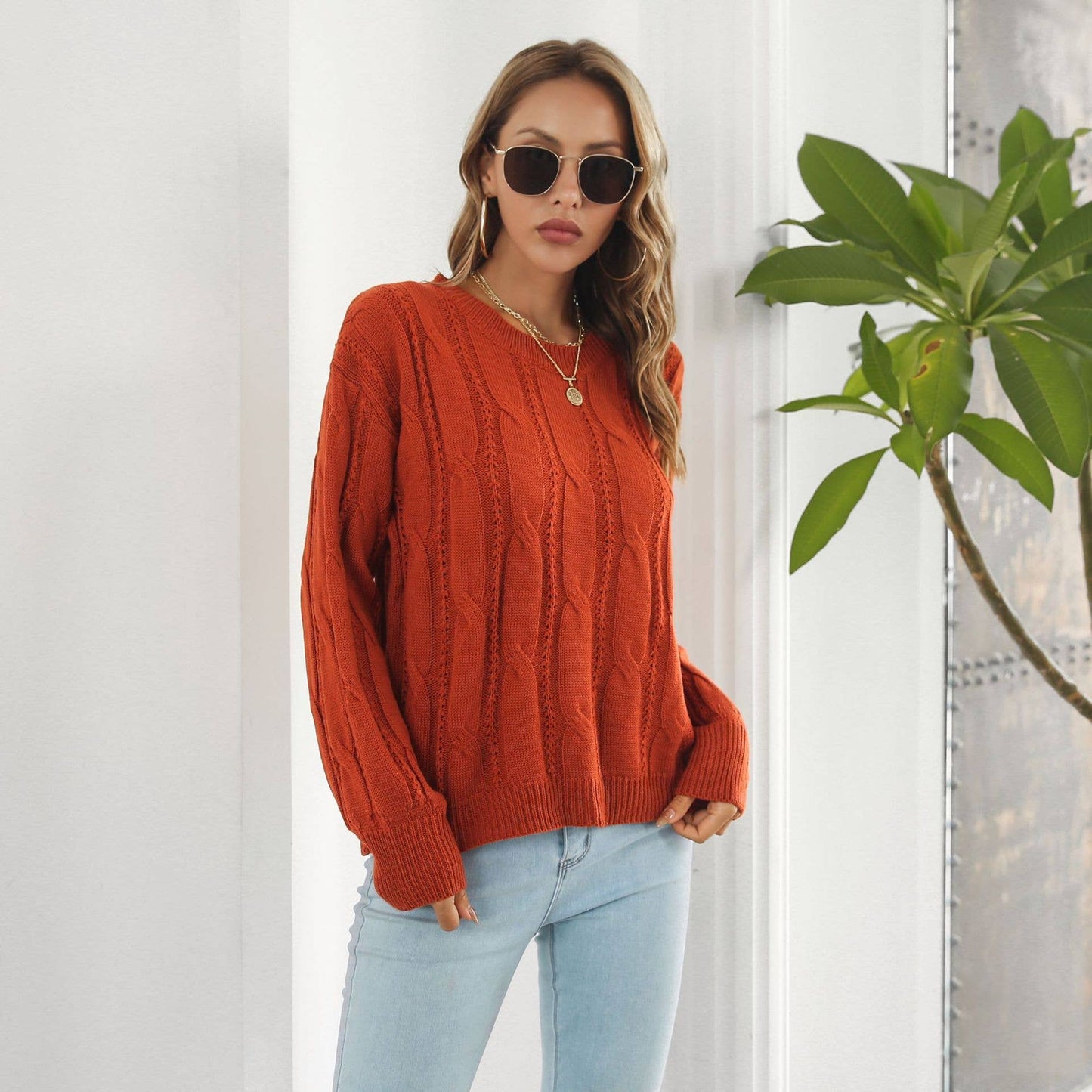 Twist hollowed loose long-sleeved sweater