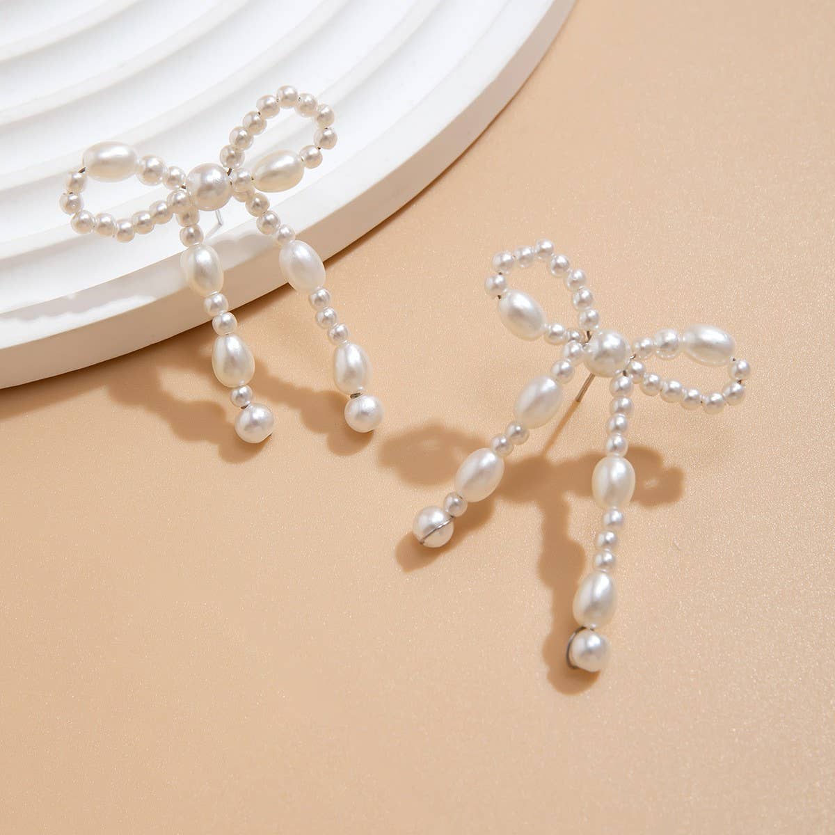 BOW FRENCH TASSEL PEARL EARRINGS_CWAJE1156