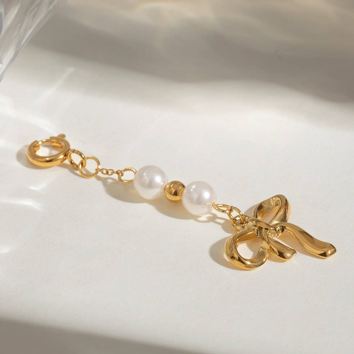 STAINLESS STEEL BIKINI BUCKLE BOW PEARL PENDANT_CWMM4690