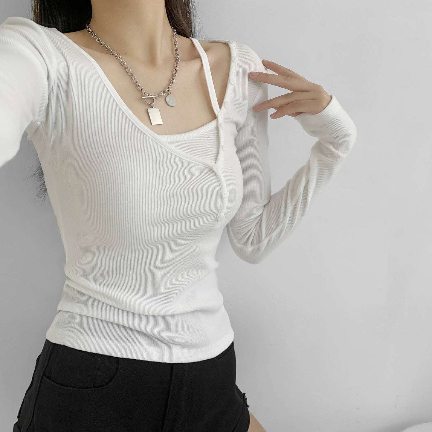 TWO BUTTON-UP LONG-SLEEVED T-SHIRTS