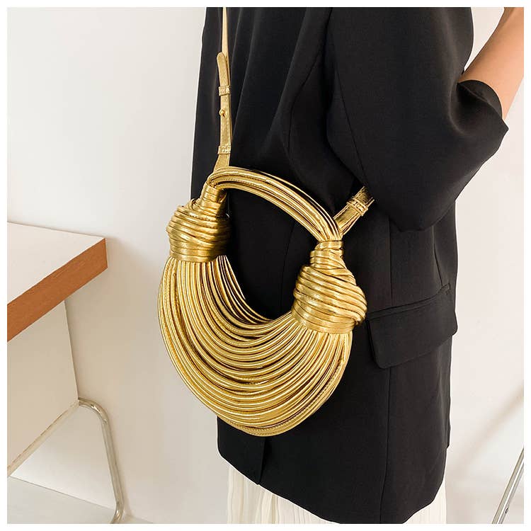 Metallic color striped appearance glossy handbag