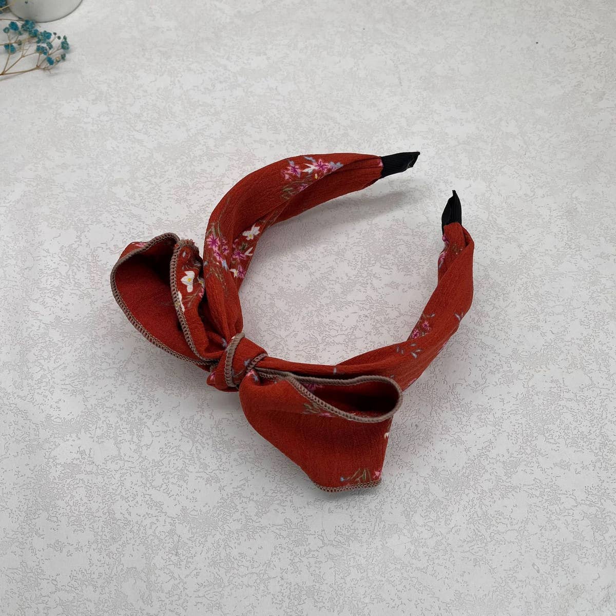 WIDE-BRIMMED FLORAL BOW HEADBAND