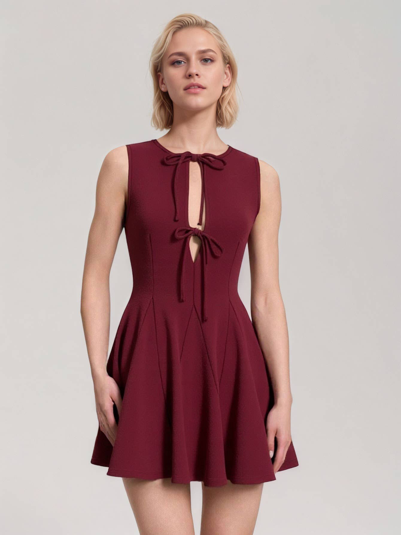 Fitted waist and bow tie sleeveless dress