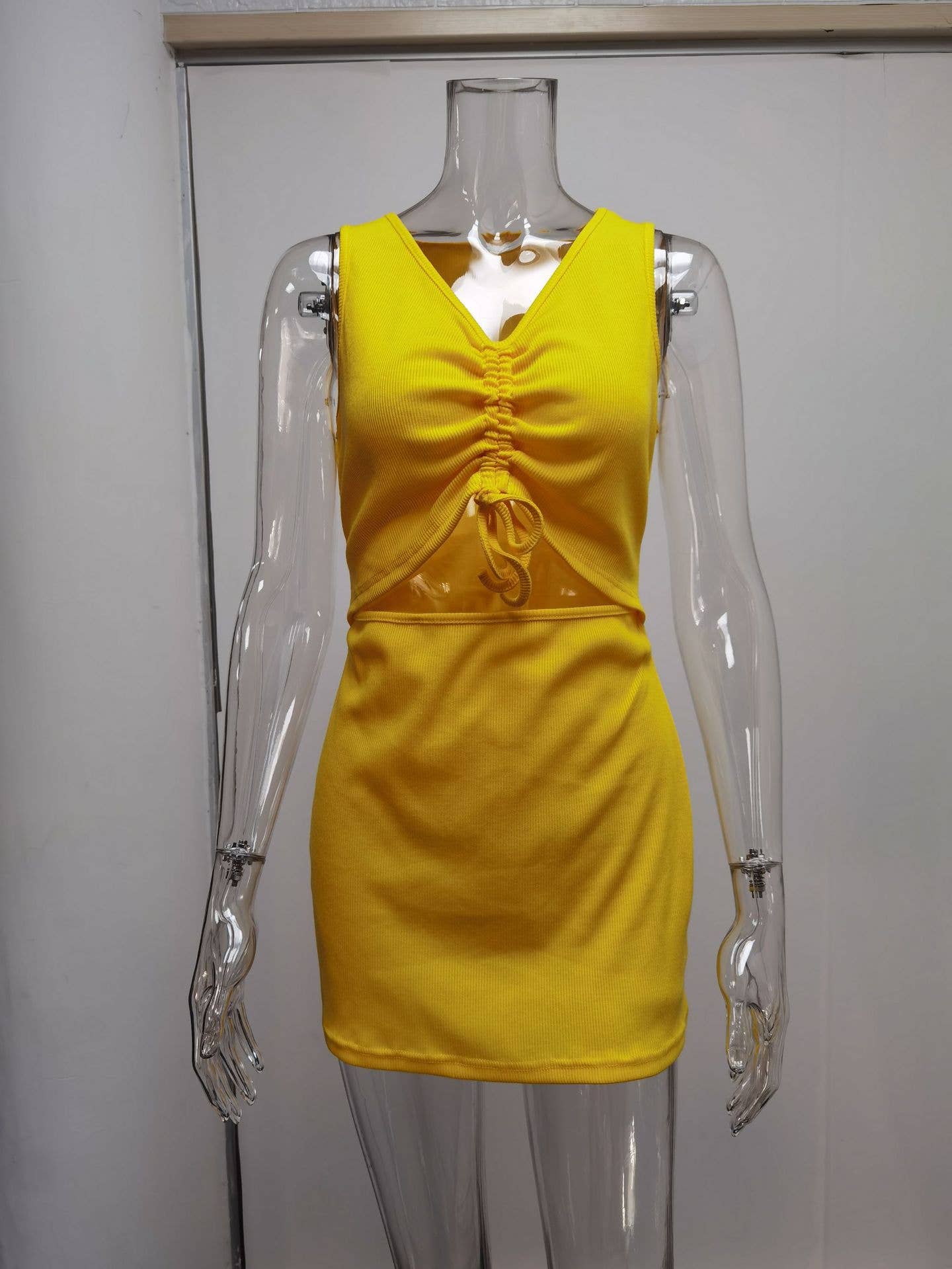 Tight-fitting dress with lace-up pleats